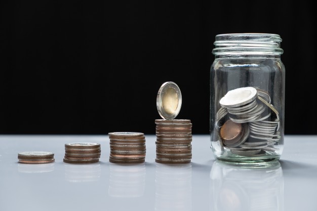 دور دراسة الجدوى في تحديد تكلفة مشروعك الاستثماري coin piles and glass for investment in the future 1423 20 - دور دراسة الجدوى في تحديد تكلفة مشروعك الاستثماري